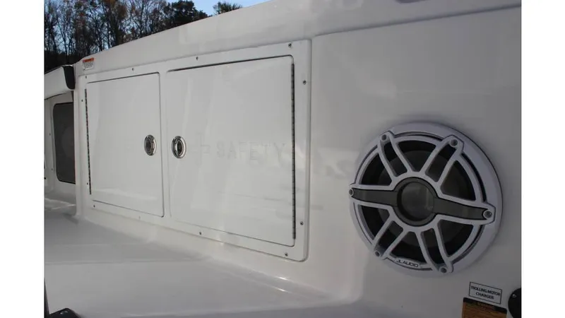 Slide: The Image of 2025 Crevalle 26 HCO boat with storage compartments and speaker detail. - 17