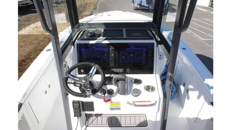 Slide: The Image of 2025 Crevalle 26 HCO boat cockpit with modern controls and navigation displays. - 18