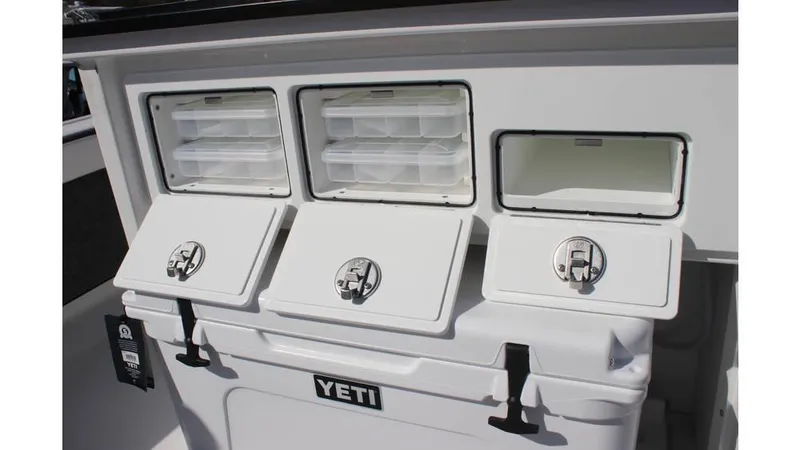 Slide: The Image of Storage compartments on a 2025 Crevalle 26 HCO boat with Yeti cooler. - 22