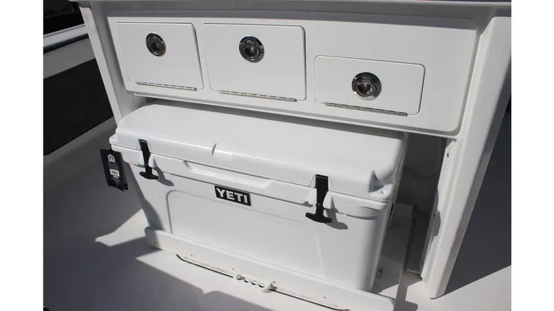Slide: The Image of 2025 Crevalle 26 HCO boat storage with Yeti cooler and drawers. - 24