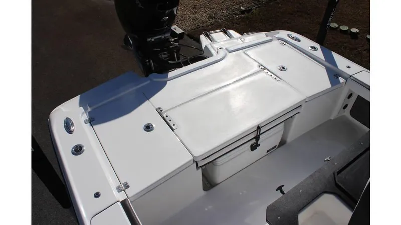 Slide: The Image of 2025 Crevalle 26 HCO boat deck with storage and motor. - 26