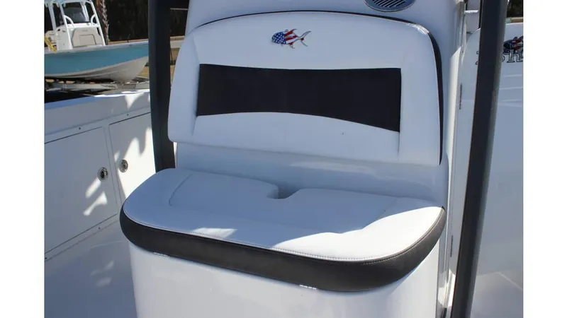 Slide: The Image of 2025 Crevalle 26 HCO boat seat with American flag fish logo. - 28