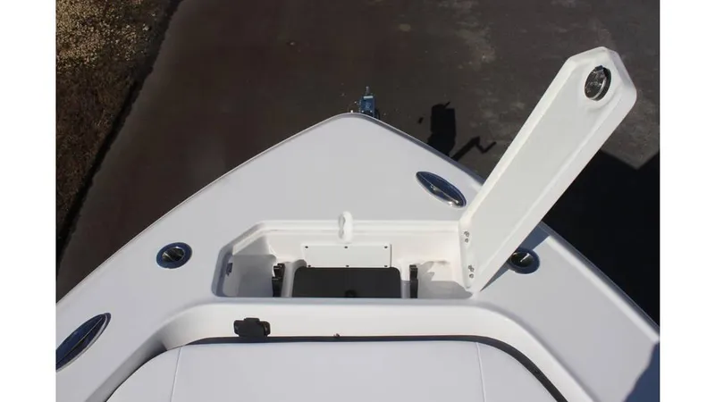 Slide: The Image of Bow view of 2025 Crevalle 26 HCO boat with open anchor locker. - 29