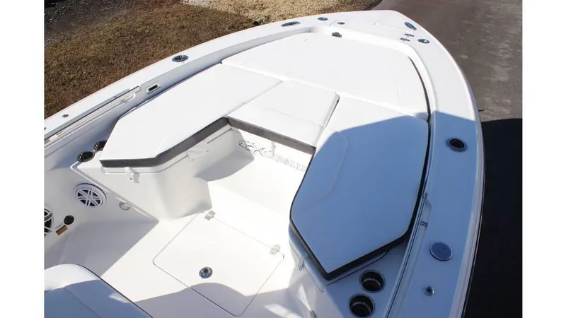 Slide: The Image of 2025 Crevalle 26 HCO boat interior with cushioned seating and storage compartments. - 30