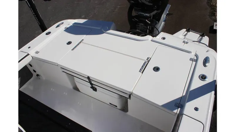 Slide: The Image of 2025 Crevalle 26 HCO boat deck with storage compartments and motor. - 31