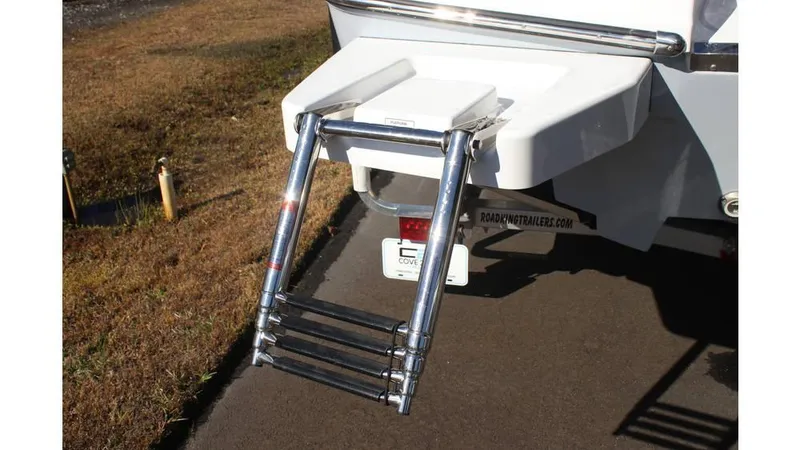 Slide: The Image of 2025 Crevalle 26 HCO boat ladder on a sunny day, showcasing sturdy design and functionality. - 32