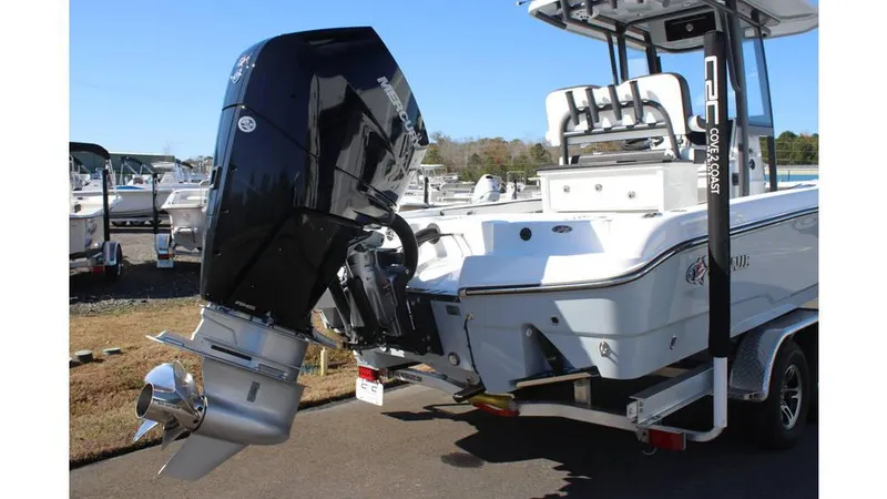 Slide: The Image of 2025 Crevalle 26 HCO boat with powerful outboard motor on trailer. - 4