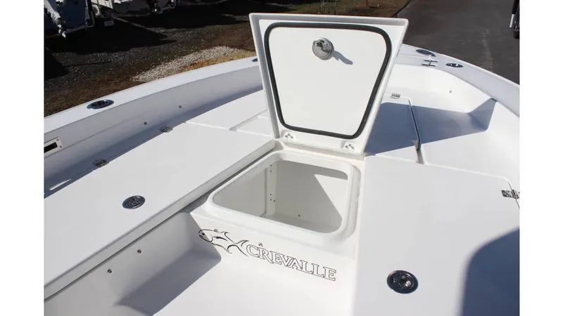 Slide: The Image of 2025 Crevalle 26 HCO boat with open storage compartment on deck. - 5