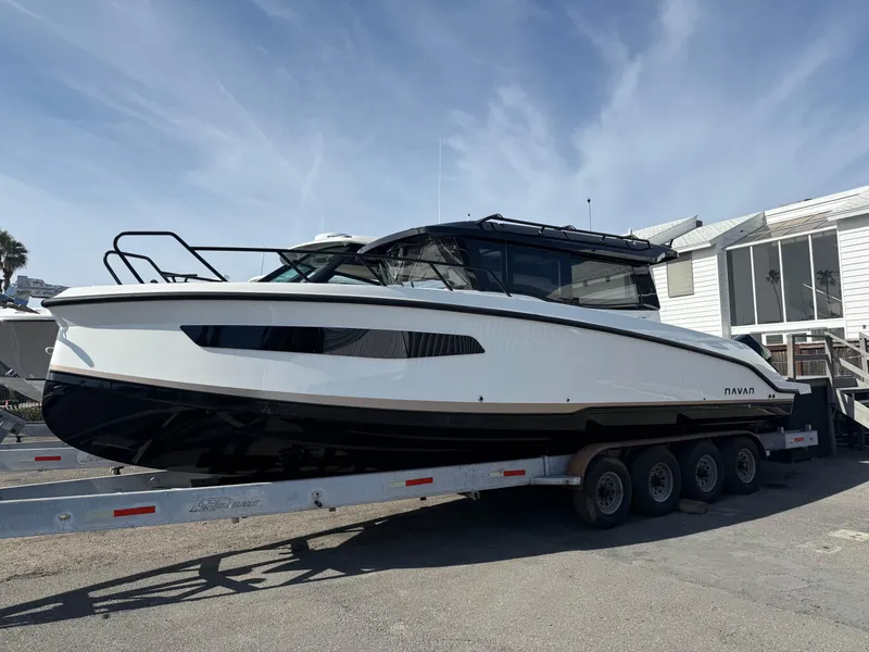 The Image of 2025 Navan C30 boat on a trailer, parked outdoors under a clear sky. - 0