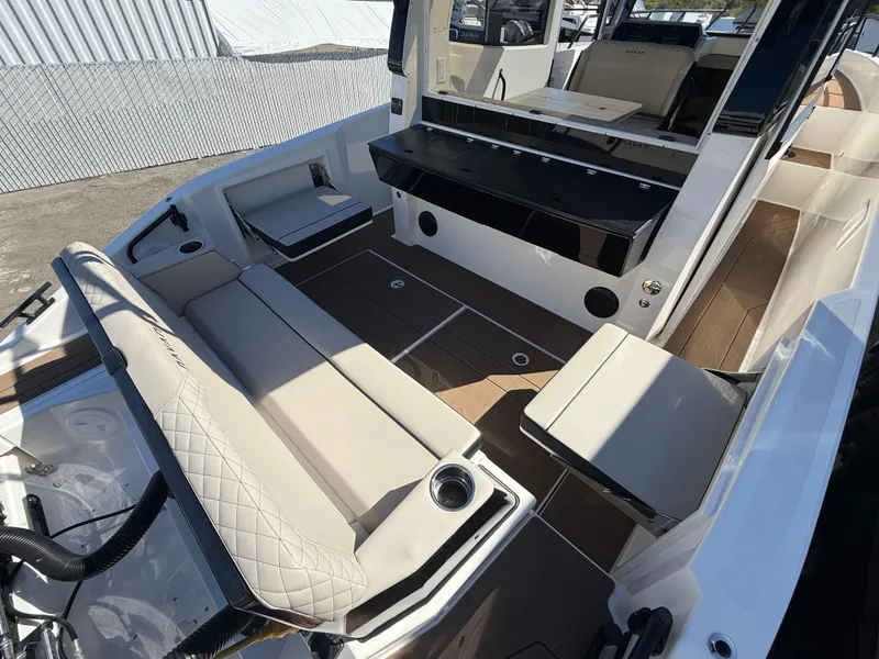 Slide: The Image of 2025 Navan C30 boat interior with beige seating, modern design, and spacious layout. - 4
