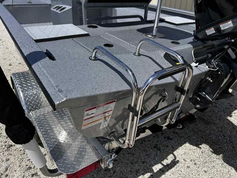 Slide: The Image of 2025 Xpress H190B boat with rear ladder and textured deck surface. - 10