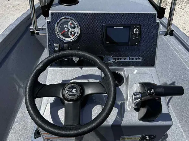 Slide: The Image of Steering console of 2025 Xpress H190B boat with gauges and controls. - 11