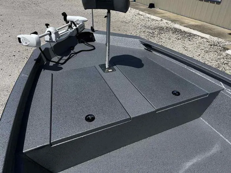 Slide: The Image of 2025 Xpress H190B boat deck with trolling motor and storage compartments. - 12