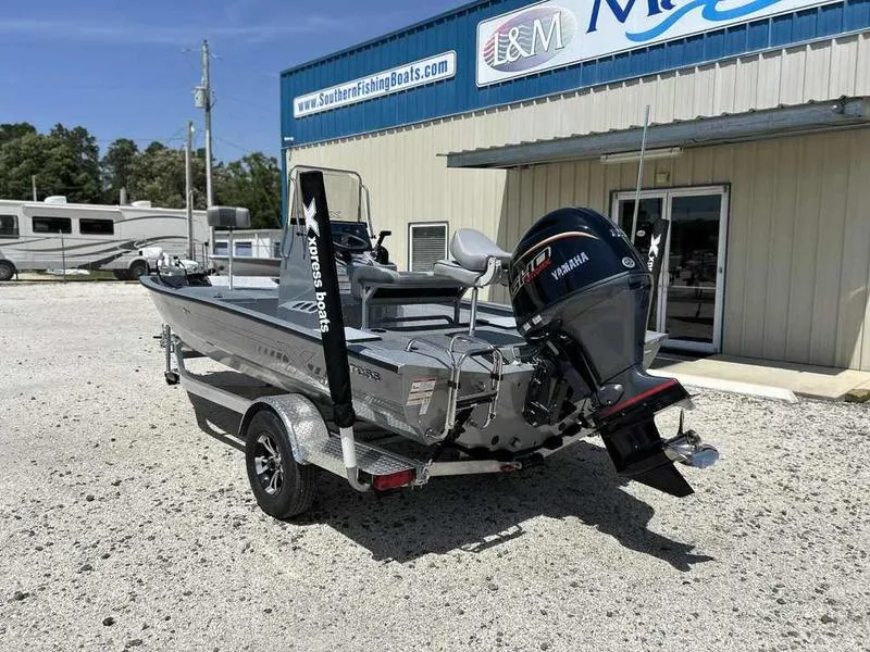 Slide: The Image of 2025 Xpress H190B boat with Yamaha engine on trailer outside dealership. - 9