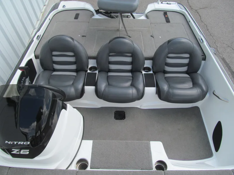 Slide: The Image of 2011 Nitro Z-6 boat interior with three gray seats and storage compartments. - 11