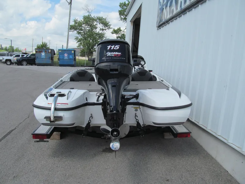 Slide: The Image of 2011 Nitro Z-6 boat with outboard motor parked outside a building. - 4