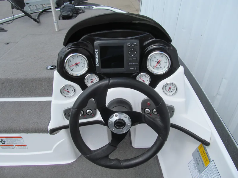 Slide: The Image of 2011 Nitro Z-6 boat dashboard with steering wheel and gauges. - 6