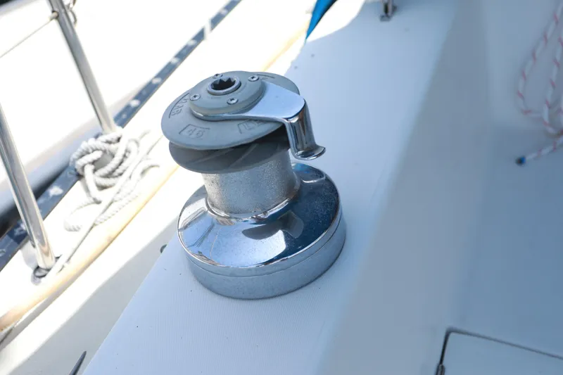 Slide: The Image of Chrome winch on 1988 Catalina 36 sailboat deck. - 13