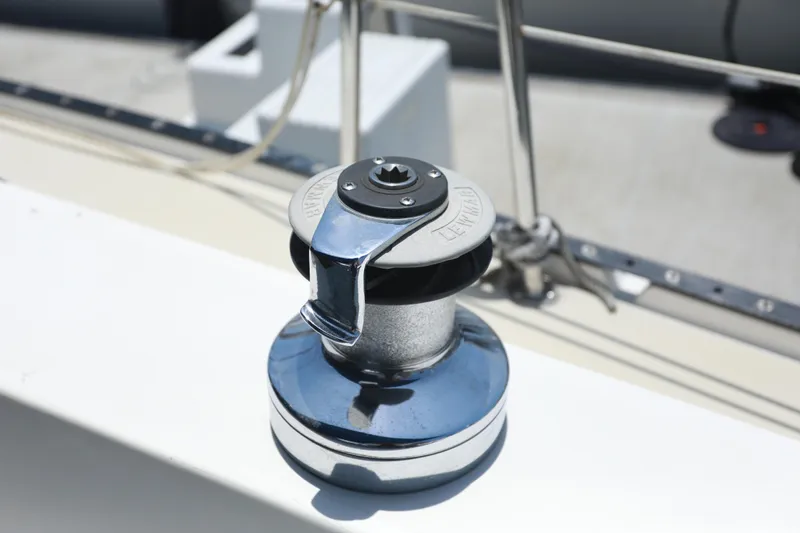 Slide: The Image of Chrome winch on 1988 Catalina 36 sailboat deck. - 14
