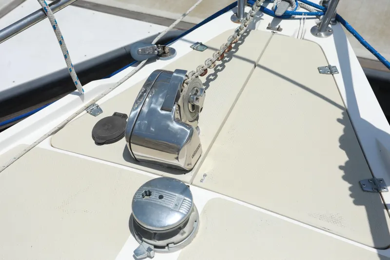 Slide: The Image of 1988 Catalina 36 yacht deck with anchor chain and winch system. - 15