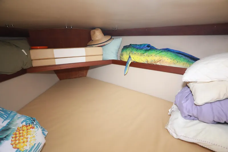 Slide: The Image of Cozy cabin interior of 1988 Catalina 36 sailboat with pillows and decor. - 36