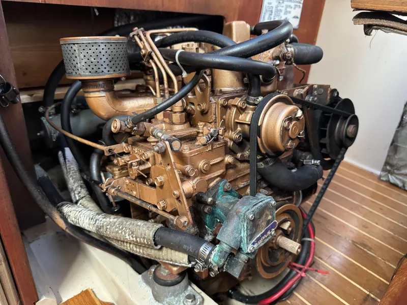 Slide: The Image of Engine of a 1988 Catalina 36 sailboat, showcasing detailed mechanical components. - 38