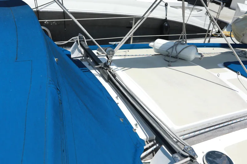 Slide: The Image of Sailboat deck with blue cover, Catalina 36, 1988 model, docked in marina. - 42