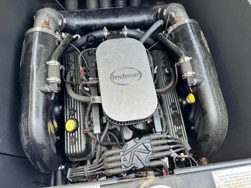 Slide: The Image of 2014 Moomba Mondo engine, showcasing Indmar components and intricate wiring. - 25