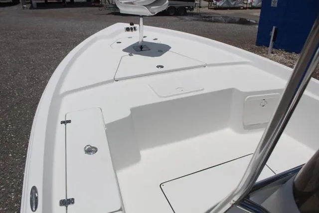 Slide: The Image of 2011 Key West 216 Bay Reef boat deck, featuring spacious seating and storage compartments. - 12