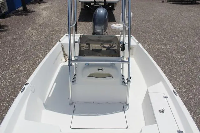 Slide: The Image of 2011 Key West 216 Bay Reef boat interior with center console and outboard motor. - 14
