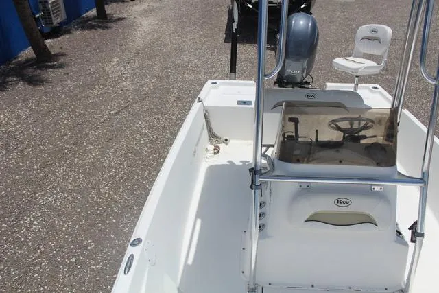 Slide: The Image of 2011 Key West 216 Bay Reef boat interior with steering console and seating. - 15