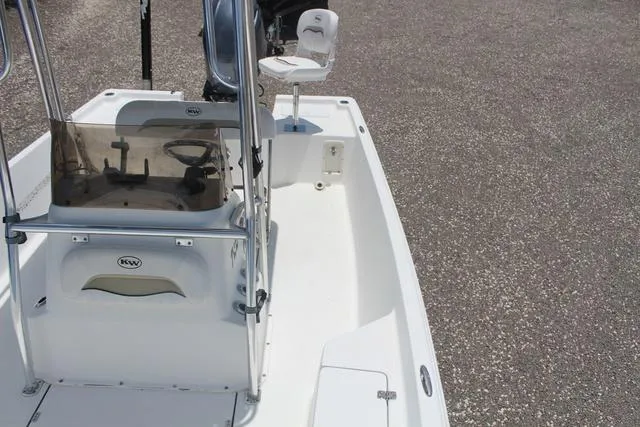 Slide: The Image of 2011 Key West 216 Bay Reef boat interior with steering console and seating. - 16