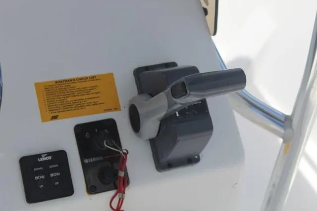 Slide: The Image of Control panel of 2011 Key West 216 Bay Reef boat with throttle and switches. - 18