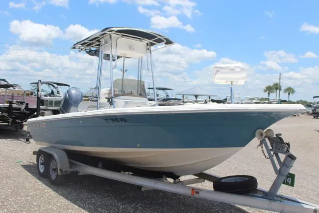 Slide: The Image of 2011 Key West 216 Bay Reef boat on trailer under blue sky. - 3