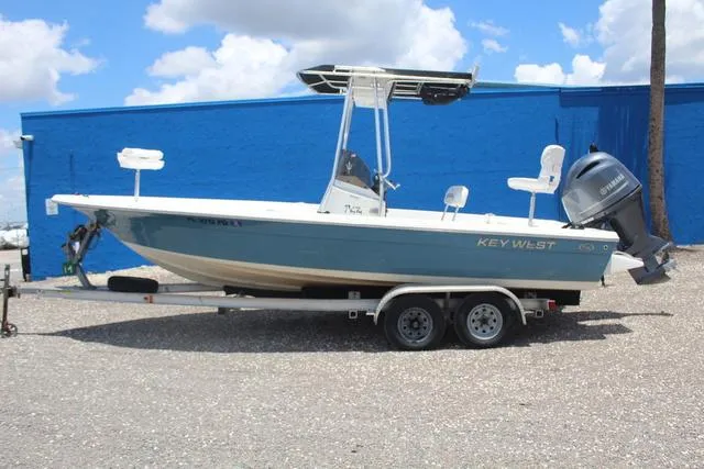 Slide: The Image of 2011 Key West 216 Bay Reef boat on trailer, blue hull, Yamaha outboard motor. - 7
