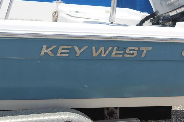 Slide: The Image of 2011 Key West 216 Bay Reef boat side view with logo. - 8