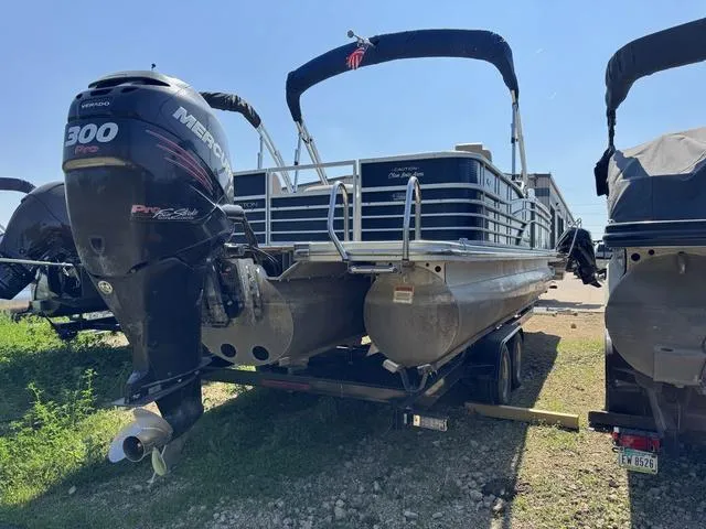 Slide: The Image of 2012 Bennington 2575 RCW pontoon boat with Mercury 300 Pro motor on trailer. - 3
