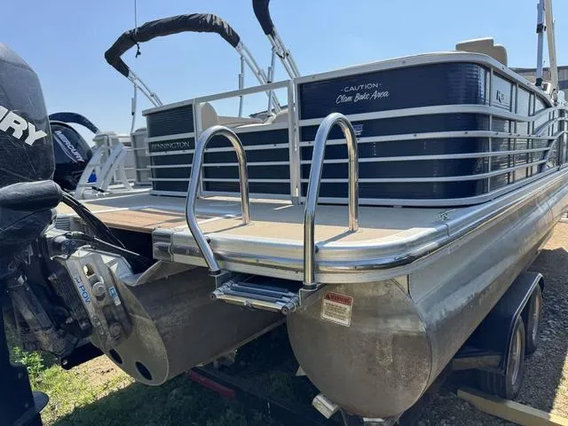 Slide: The Image of 2012 Bennington 2575 RCW pontoon boat with Mercury outboard motor, rear view. - 4
