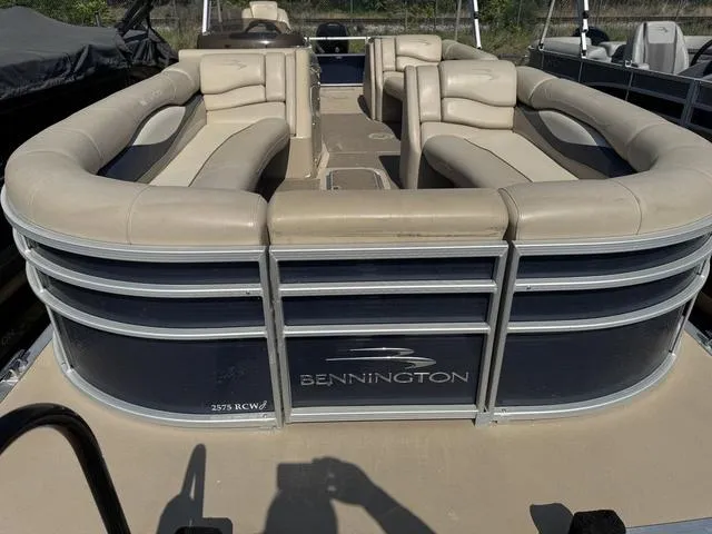 Slide: The Image of 2012 Bennington 2575 RCW pontoon boat with beige seating and sleek design. - 6