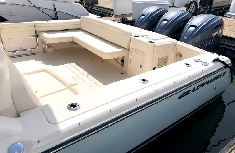 Slide: The Image of 2023 Grady-White Freedom 375 boat with spacious seating and triple Yamaha engines. - 15