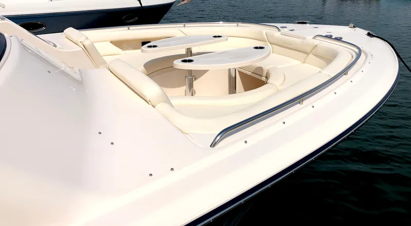 Slide: The Image of 2023 Grady-White Freedom 375 boat with spacious seating and table on deck. - 16