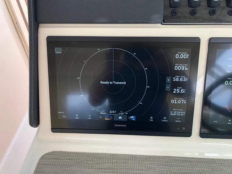 Slide: The Image of Garmin navigation display on 2023 Grady-White Freedom 375 boat dashboard. - 20