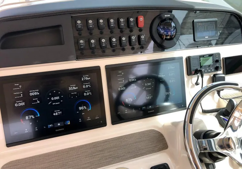 Slide: The Image of 2023 Grady-White Freedom 375 dashboard with advanced navigation and control systems. - 22