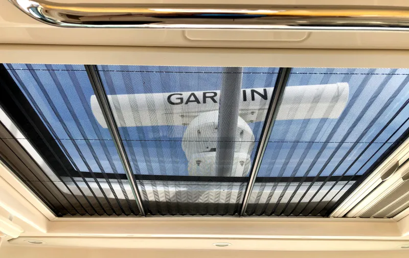 Slide: The Image of 2023 Grady-White Freedom 375 boat with Garmin radar viewed through sunroof. - 25