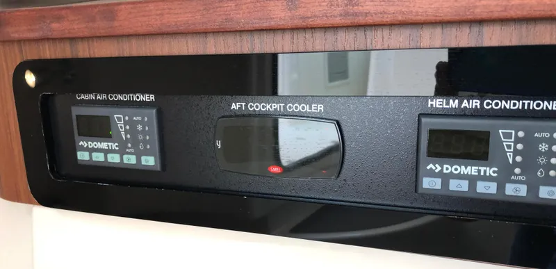 Slide: The Image of Control panel of 2023 Grady-White Freedom 375 with air conditioning and cooler settings. - 28