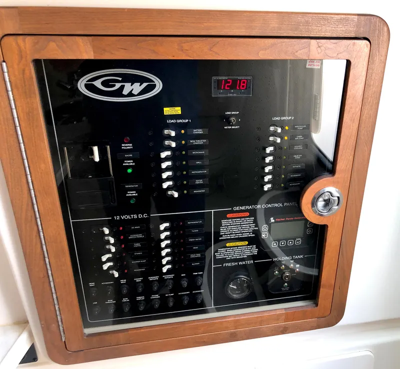 Slide: The Image of Control panel of 2023 Grady-White Freedom 375 boat, featuring various switches and indicators. - 29