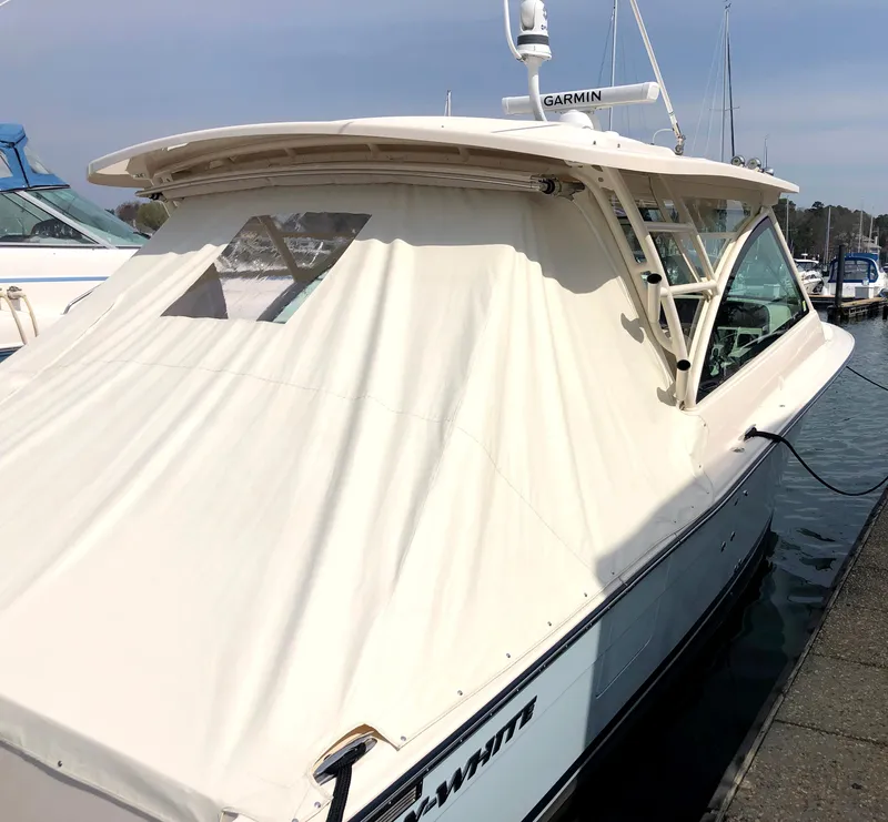 Slide: The Image of 2023 Grady-White Freedom 375 boat docked with protective cover. - 3