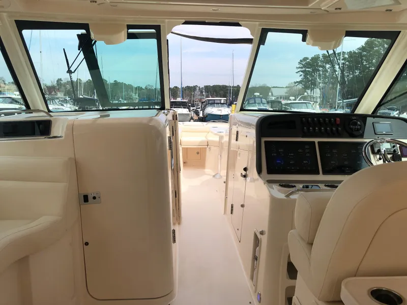 Slide: The Image of 2023 Grady-White Freedom 375 boat interior with helm, dashboard, and seating. - 32