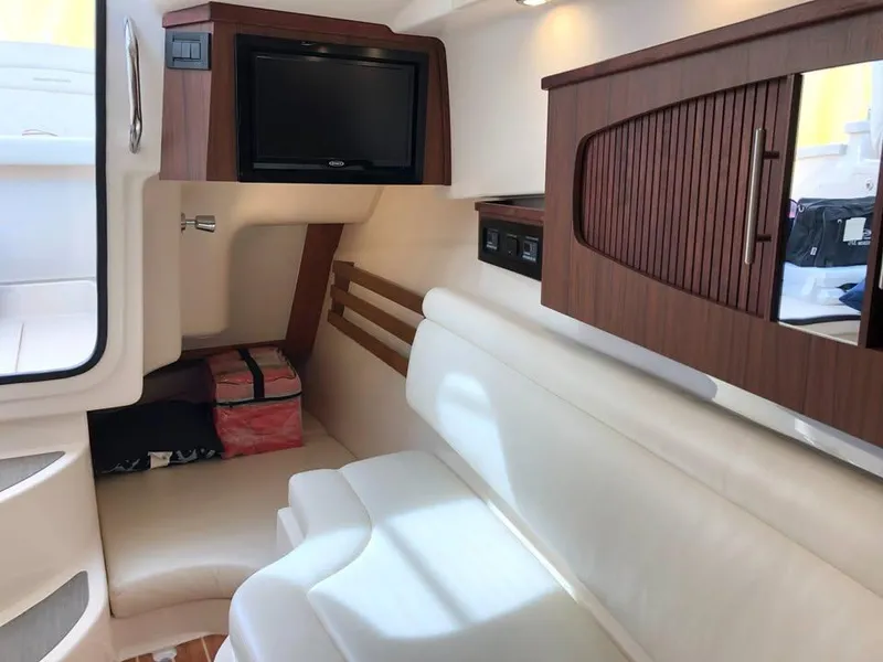 Slide: The Image of Interior of 2023 Grady-White Freedom 375 boat with seating and TV. - 34