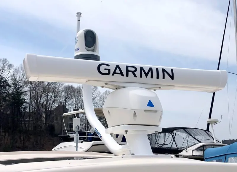 Slide: The Image of 2023 Grady-White Freedom 375 boat with Garmin radar system, docked near trees. - 35